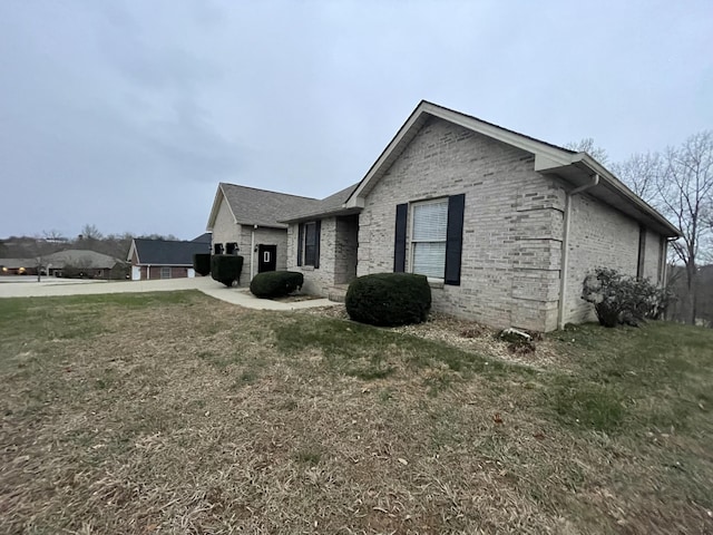 view of home's exterior featuring a lawn