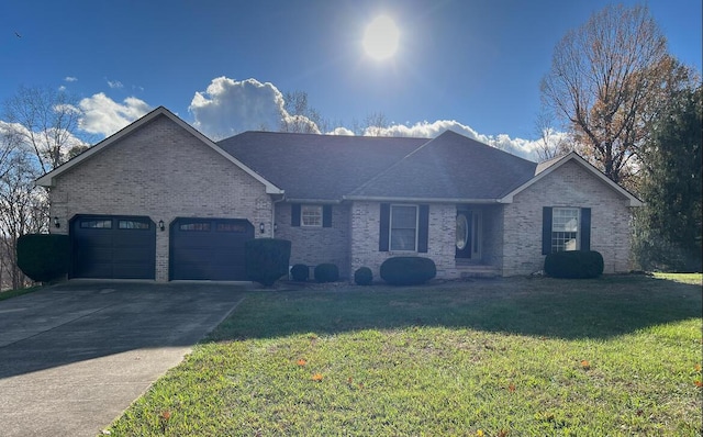 ranch-style house with a garage and a front lawn