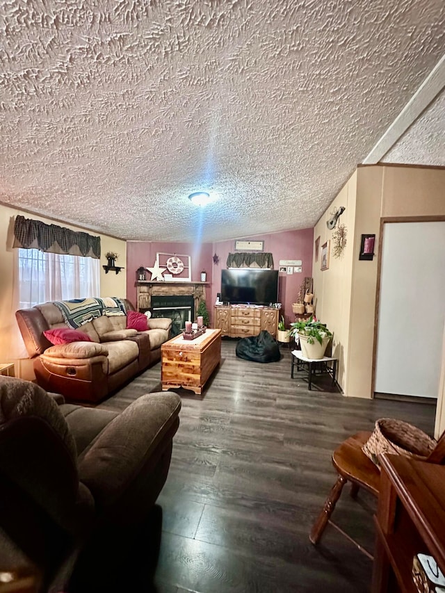 living room with lofted ceiling, wood-type flooring, and a textured ceiling