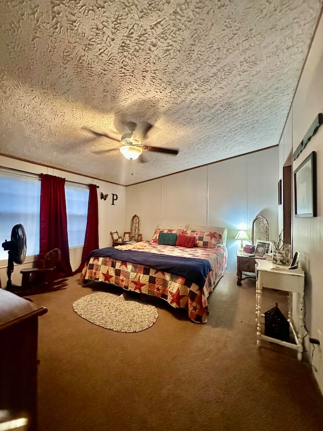 carpeted bedroom with ceiling fan and a textured ceiling