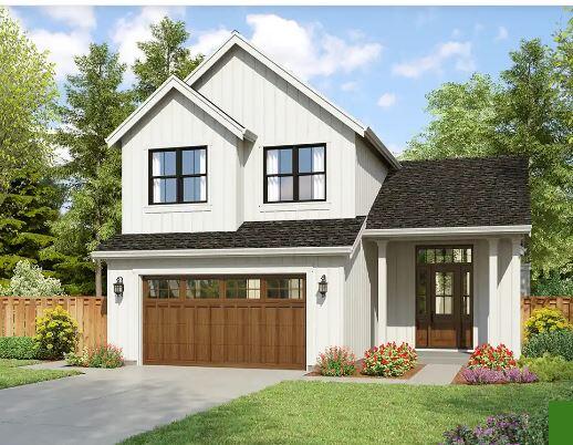 view of front facade with a front lawn and a garage