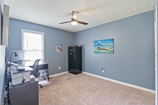 office with light carpet, ceiling fan, and a textured ceiling