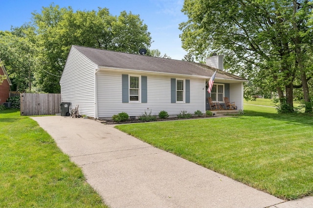 ranch-style house featuring a porch and a front yard