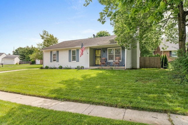 single story home with a porch and a front yard