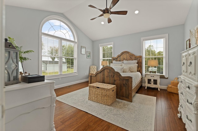 bedroom with ceiling fan, dark hardwood / wood-style floors, and lofted ceiling