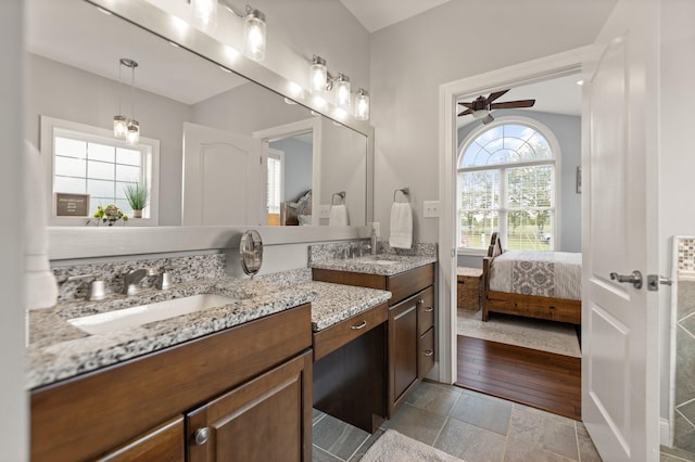 bathroom featuring ceiling fan, vanity, and hardwood / wood-style flooring