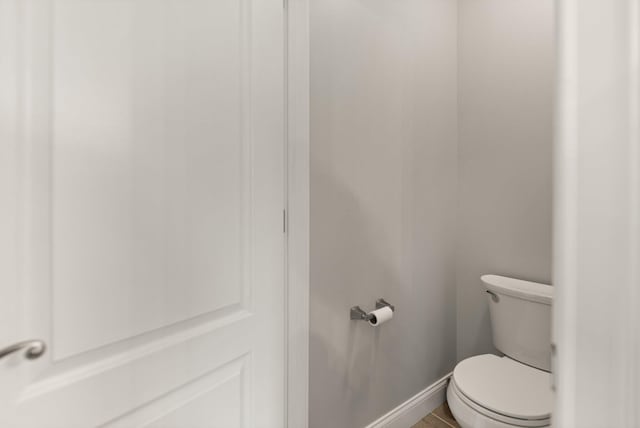 bathroom with tile patterned floors and toilet