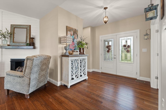 entryway featuring french doors, dark hardwood / wood-style flooring, and vaulted ceiling