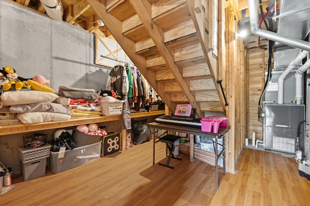 unfinished attic featuring heating unit