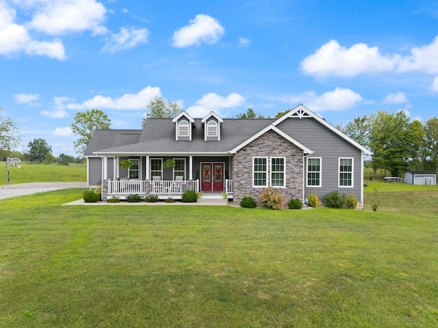 view of front of home with a porch and a front lawn