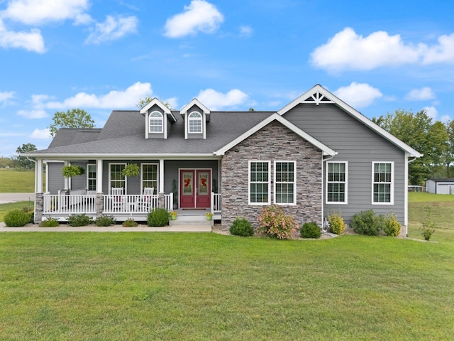 view of front of property featuring covered porch and a front lawn