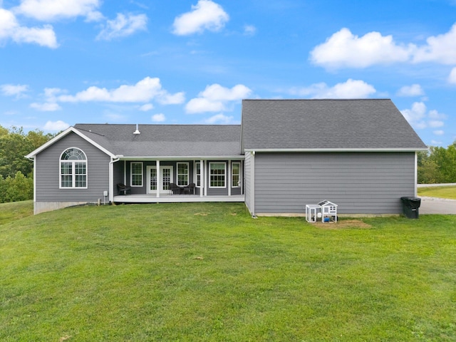 rear view of house with a lawn