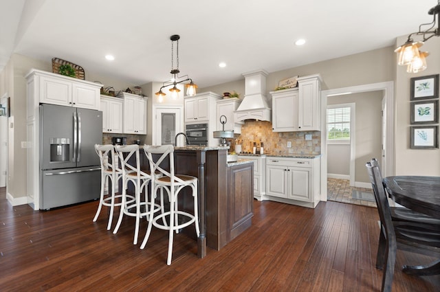 kitchen featuring white cabinetry, dark hardwood / wood-style flooring, custom exhaust hood, and appliances with stainless steel finishes