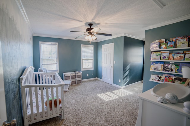 bedroom featuring carpet flooring, ceiling fan, crown molding, and a nursery area