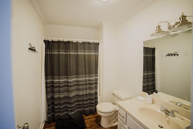 bathroom featuring crown molding, toilet, hardwood / wood-style flooring, vanity, and a shower with shower curtain