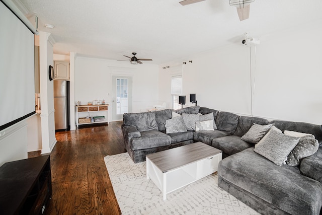 living room featuring ceiling fan, crown molding, and hardwood / wood-style flooring