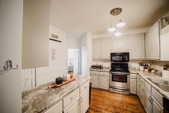 kitchen featuring white cabinetry, dark hardwood / wood-style flooring, pendant lighting, and stainless steel range with electric stovetop