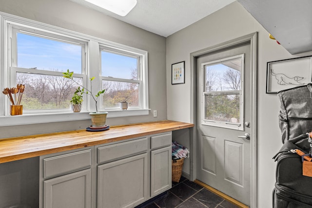 doorway featuring a textured ceiling