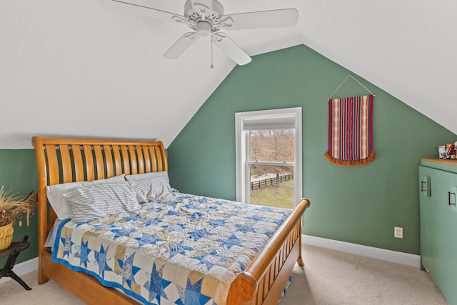 bedroom featuring lofted ceiling, light colored carpet, and ceiling fan