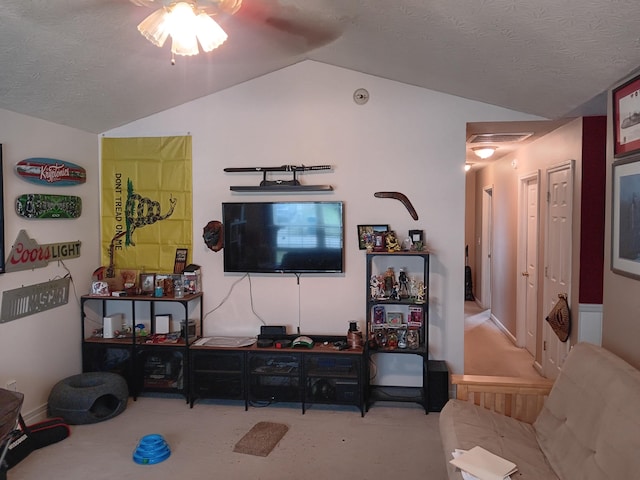 living area with a textured ceiling, visible vents, vaulted ceiling, and carpet flooring