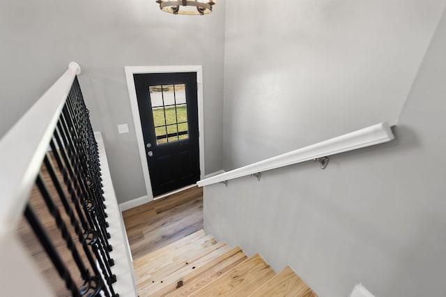 entryway featuring a chandelier and hardwood / wood-style flooring