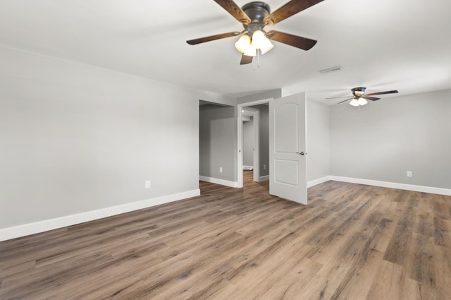 unfurnished room with wood-type flooring