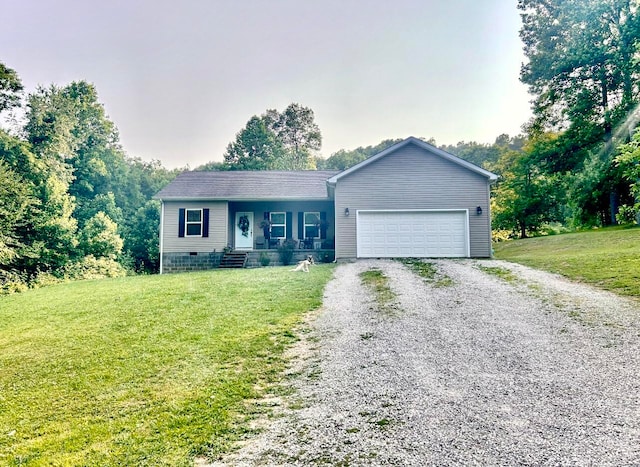 view of front of home featuring a front yard and a garage