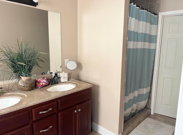 bathroom featuring a shower with curtain and vanity