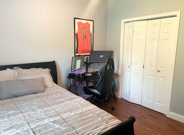 bedroom featuring wood-type flooring and a closet