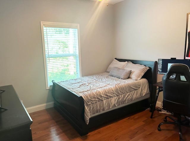 bedroom featuring dark hardwood / wood-style floors