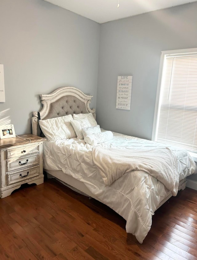 bedroom featuring dark hardwood / wood-style flooring