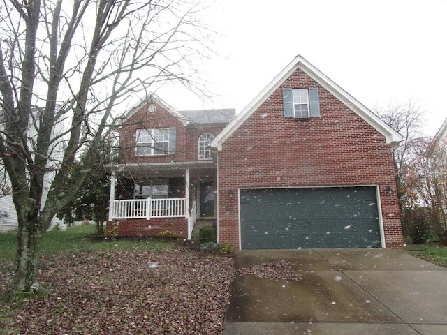 view of front of property with a garage and covered porch