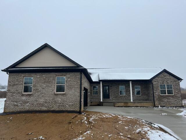 view of front facade featuring brick siding