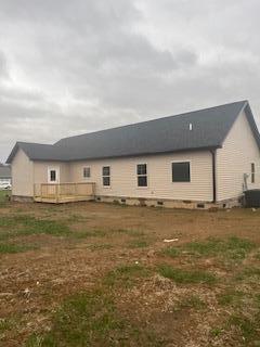 view of side of property with a deck