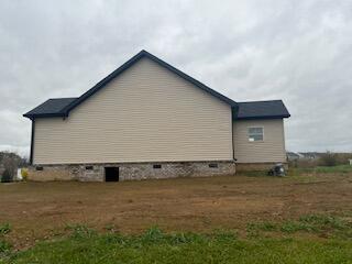 view of property exterior with crawl space