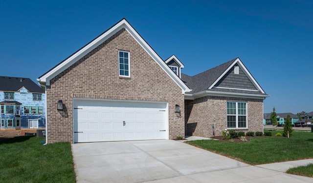 view of front facade with a front yard and a garage