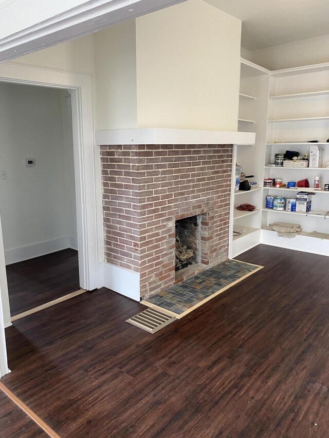 kitchen with decorative backsplash, appliances with stainless steel finishes, and dark hardwood / wood-style flooring