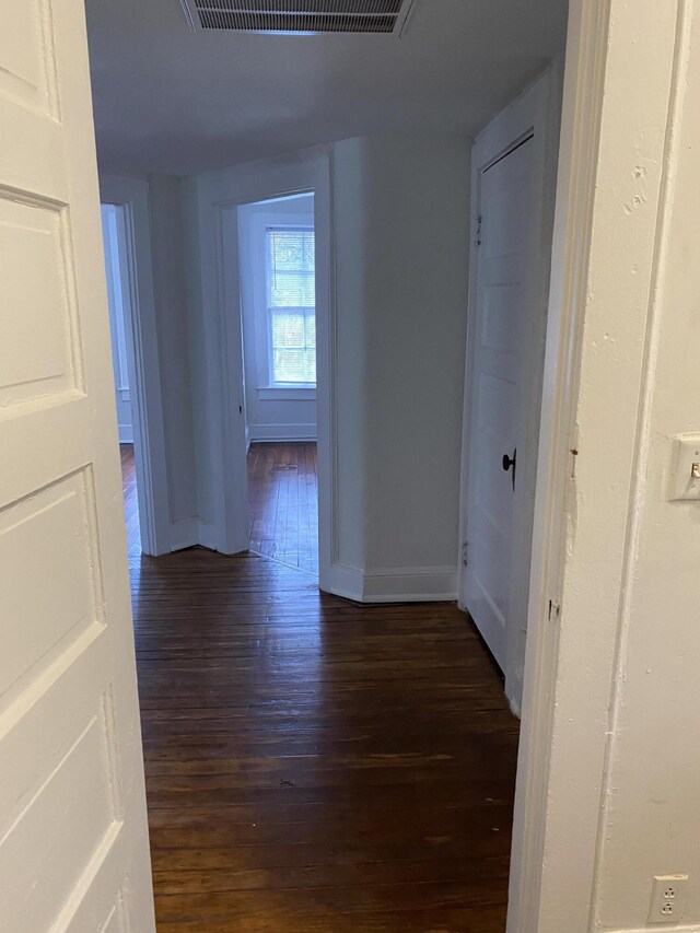 additional living space featuring dark hardwood / wood-style flooring and lofted ceiling