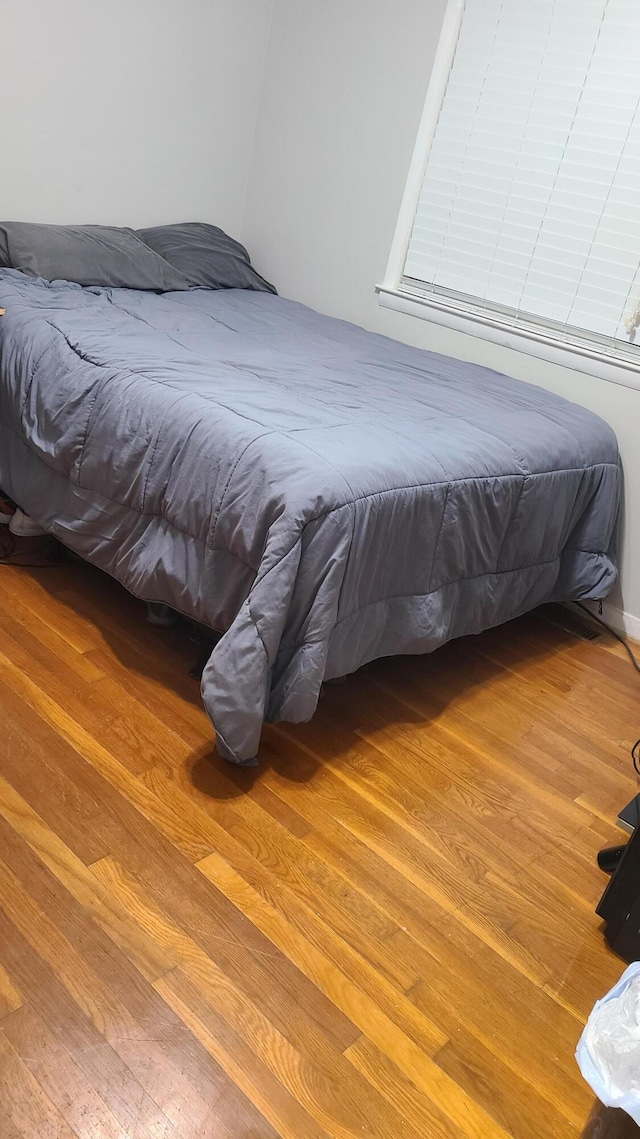 bedroom featuring hardwood / wood-style flooring