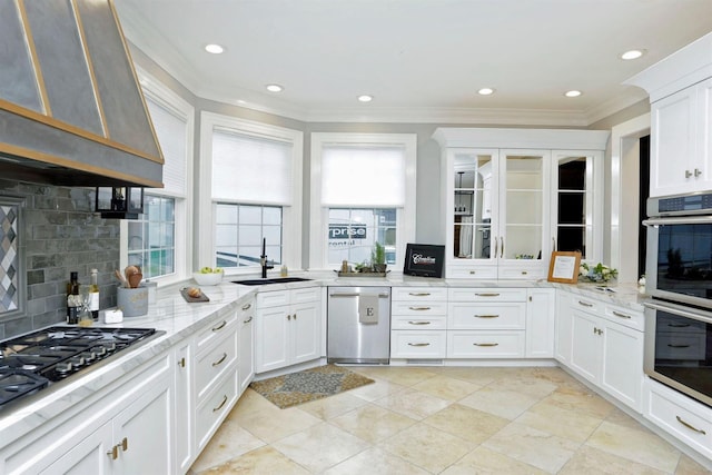 kitchen featuring extractor fan, stainless steel appliances, light stone countertops, white cabinets, and sink