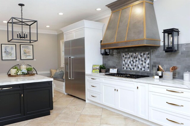 1602 Winners Cir # 41, Lexington, KY 40513 - kitchen featuring appliances with stainless steel finishes, custom exhaust hood, crown molding, decorative backsplash, and white cabinetry