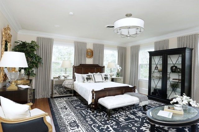 bedroom featuring crown molding and hardwood / wood-style flooring