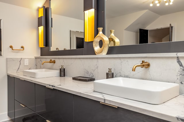 bathroom featuring decorative backsplash and vanity