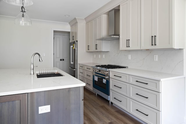 1602 Winners Cir # 41, Lexington, KY 40513 - kitchen with high quality appliances, wall chimney range hood, decorative backsplash, dark wood-type flooring, and hanging light fixtures
