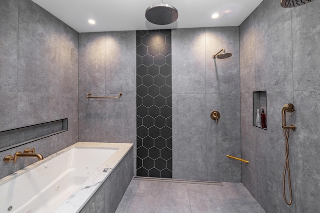 bathroom featuring plus walk in shower, tile patterned flooring, and tile walls