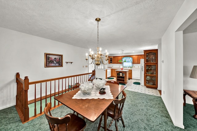 dining area with a notable chandelier, light colored carpet, and a textured ceiling