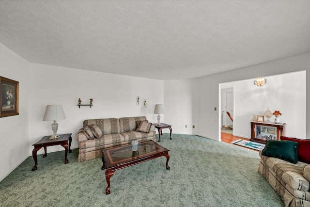 living room with carpet floors and a textured ceiling