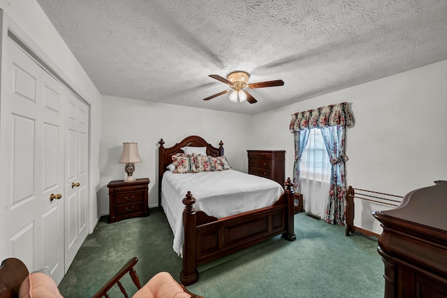 carpeted bedroom with ceiling fan, a closet, and a textured ceiling