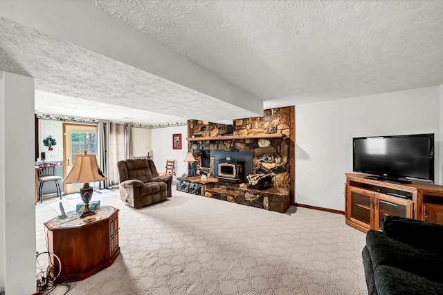 carpeted living room with a wood stove and a textured ceiling