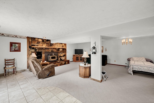 living room featuring a wood stove, light carpet, a chandelier, and a textured ceiling